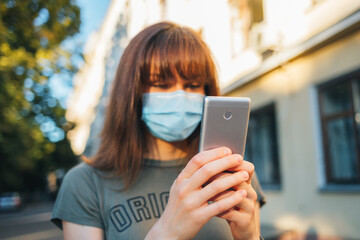 Close-up of young woman wearing face mask to protect against virus