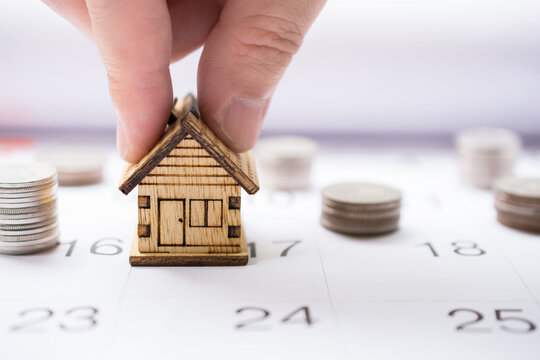 House And Money Set On Calendar For Concept Investment Mortgage And Refinance