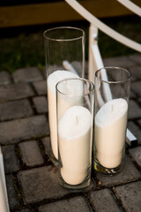 Wedding decoration. White candles on the floor.