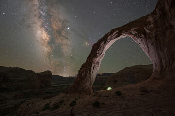 Camping tent underneath Corona Arch and the Milky Way Galaxy - Powered by Adobe