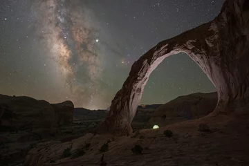 Camping tent underneath Corona Arch and the Milky Way Galaxy © Michael