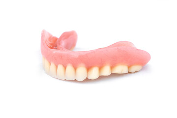 Acrylic dentures isolated on white background. Removable dentures flexible. False teeth.