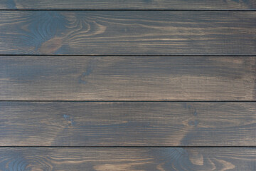 top view of dark wooden background made of planks. Copy space for text. Natural textures and backgrounds concept