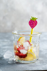 Refreshing homemade lemonade from berries and lemon.