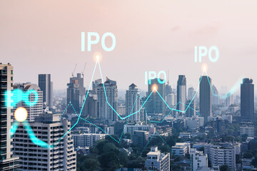IPO icon hologram over panorama city view of Bangkok, the hub of initial public offering in Asia....