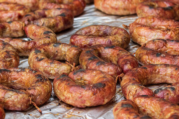 Healthy street food to go - sausages. Delicious food cooked over an open fire, which is offered at a street food fair, event, festival.