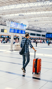 Airport European Nerd Man In Glasses And Plaid Shirt With Luggage Tourist Boarding Plane Taking A Flight Wearing Face Mask. Coronavirus Flu Virus Travel 