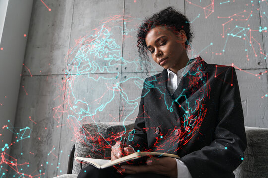 Businesswoman taking notes and world map hologram. Double exposure. Technology security network solution planet earth international business concept.