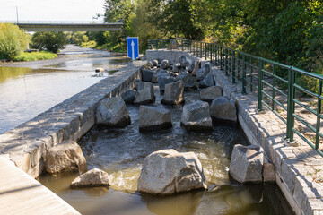 Fish ladder, fishway, fish pass or fish steps passage though weir crossing on a river