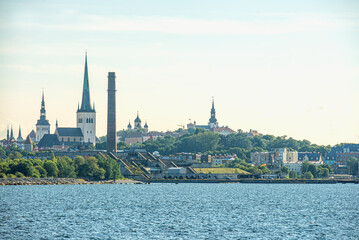 Scenic summer panorama of pier with historical tall sailing ship in the Old Town in Tallinn, Estonia.