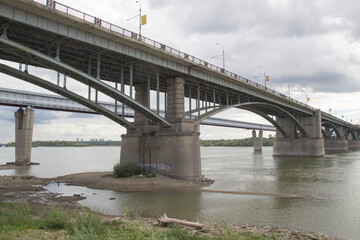 Bridges over the Ob river in Novosibirsk. The world's largest metro bridge and Communal bridge across Ob river in Novosibirsk, Russia
