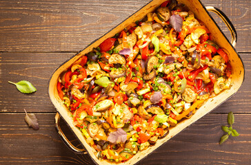 Stewed vegetables in an bowl, eggplant with zucchini and tomatoes, sweet and hot peppers and spices, mixing of Ratatouille ingredients in a bowl