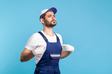This is me! Egoistic handyman in overalls pointing himself and looking with arrogance, proud of...
