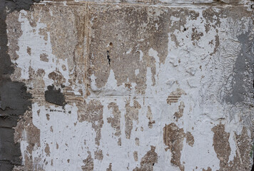 A large fragment of the old structure of concrete blocks, large concrete bricks with cracks and roughness. Old building materials, building houses in the past. Retro style