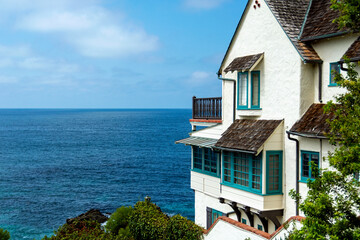 Exterior of 1929 English Tudor-style home with spectacular ocean views in Wood's Cove, is registered as a historic structure.