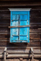 Naklejka na ściany i meble old abandoned house with beautiful blue shutters
