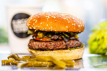 Classic beef Burger with vegetables is on the table