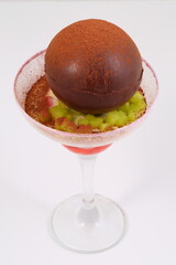 Chocolate sphere dessert. Ice cream in a chocolate ball
