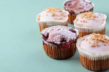 yummy sweet tasty muffin cakes on simple mono color background