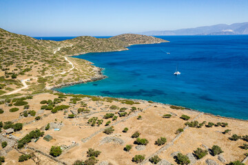 Fototapeta na wymiar Aerial view of the Cretan coastline and clear sea in the middle of summer