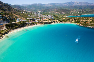 Fototapeta na wymiar Aerial view of the beautiful sandy beach and crystal clear waters of Voulisma Beach, Crete, Greece