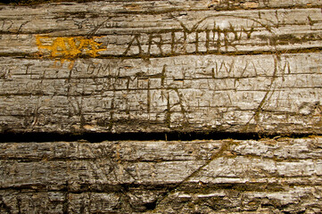 New fresh graffiti over old names and initials.