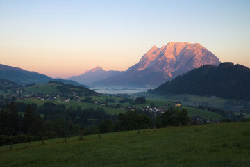 Fototapeta na wymiar Landscape of Enns valley with mount Grimming at sunrise, Styria, Alps, Austria