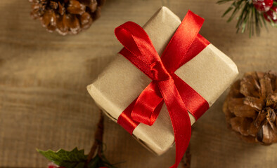 Fototapeta premium Flatley Christmas. Festive Christmas background. New Year's and Christmas. Christmas card background. Gift with red ribbon. Cones. Copyspace