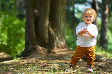 emotional portrait of a child in a white shirt