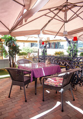.a table in a street cafe on a summer sunny day
