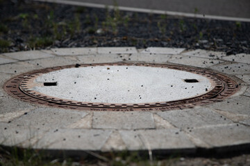 closeup of a new manhole cover