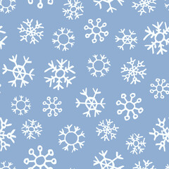 Seamless background of hand drawn snowflakes