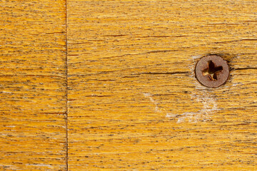 Wood texture with an old screw. Horizontal background.
