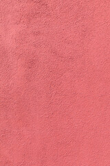 pattern of red painted plaster wall