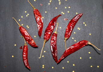 Dried red chili or chilli cayenne pepper isolated on black background