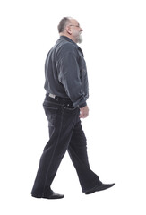 in full growth. happy bearded man striding forward.