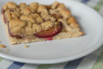 piece of plum cake on a white plate
