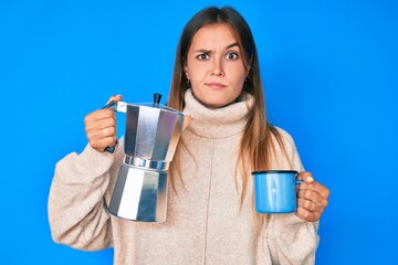 Beautiful caucasian woman drinking italian coffee skeptic and nervous, frowning upset because of problem. negative person.