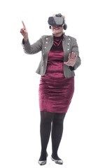 surprised young woman in a virtual reality helmet. isolated on a white