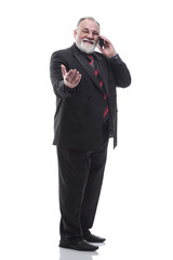 friendly businessman talking on his smartphone. isolated on a white