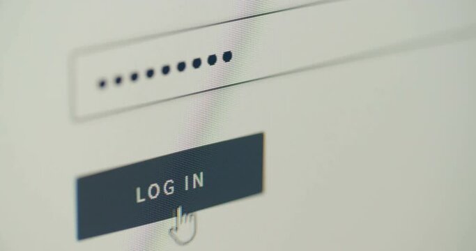 Extreme closeup shot - typing a login password and clicking on a login button.
