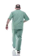 Obraz premium in full growth. Mature doctor with a stethoscope confidently stepping forward