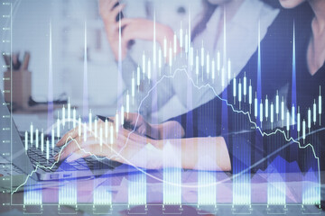 Multi exposure of woman hands typing on computer and financial graph hologram drawing. Stock market analysis concept.