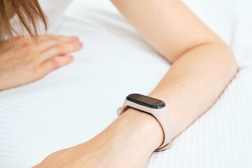 Smart watch on the hand of a Caucasian girl