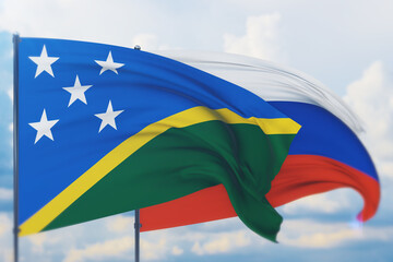 Waving Russian flag and flag of Solomon Islands. Closeup view, 3D illustration.