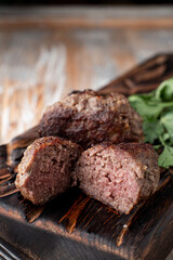Close up of prepared beef meatballs cut in halves