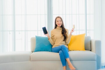 Portrait beautiful young asian woman with credit card and smart phone