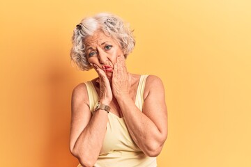 Senior grey-haired woman wearing casual clothes tired hands covering face, depression and sadness, upset and irritated for problem