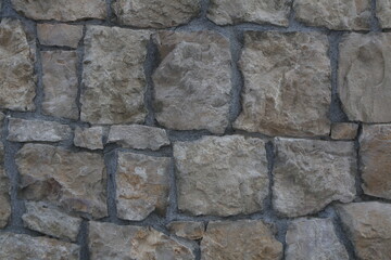 texture di un muro di sassi colorati e cementati