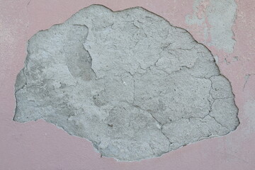texture di muro di cemento rosa con crepa nel mezzo
